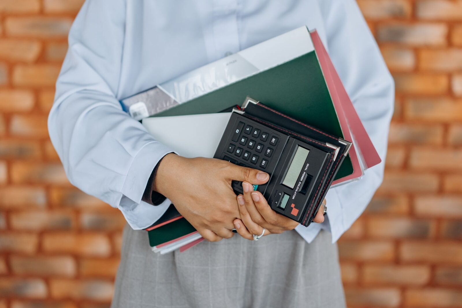 Bookkeeping desk with ledgers and a calculator at an Edmonton accounting firm