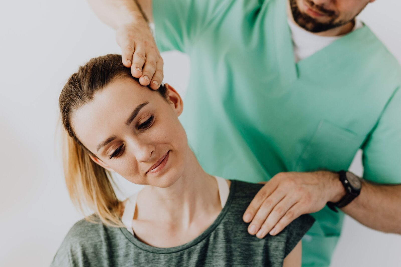 Chiropractor adjusting a patient in an Edmonton clinic
