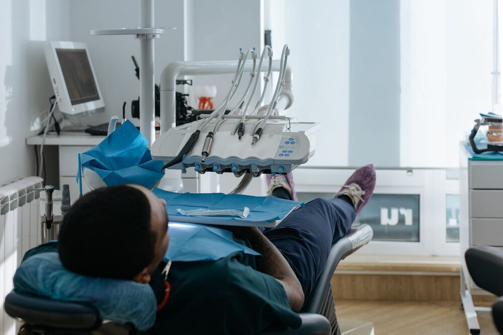Edmonton dentist reviewing a patient's treatment plan on a tablet