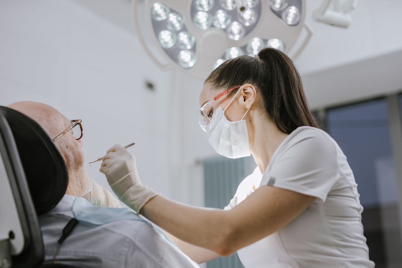Smiling patient at an Edmonton dental clinic reception desk