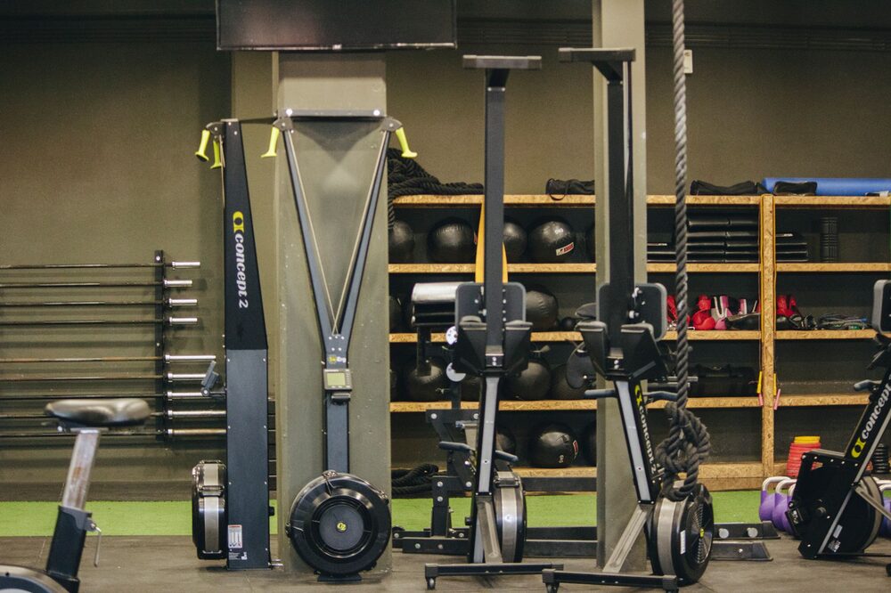 New member touring an Edmonton 24-hour gym during a free pass visit