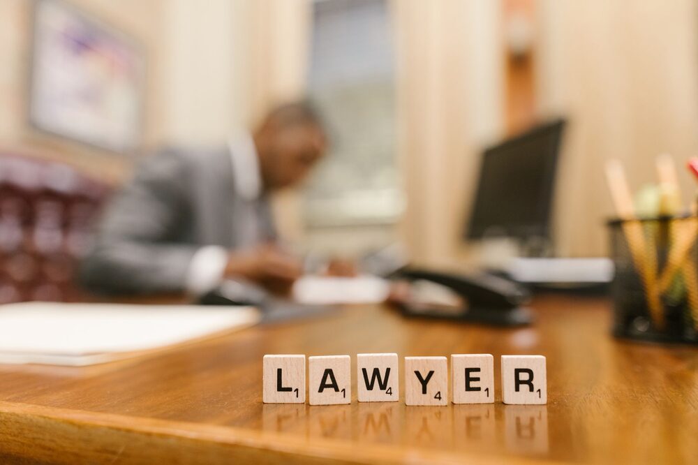 Attorney working at a desk reviewing legal documents in an Edmonton law office