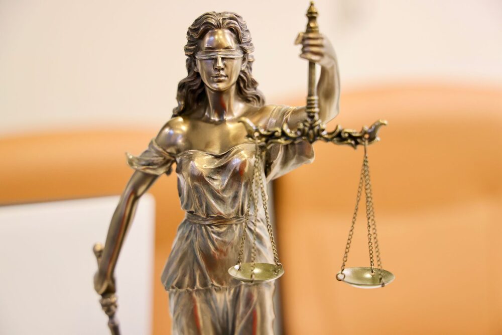 Scales of justice and gavel symbolizing legal authority and trust