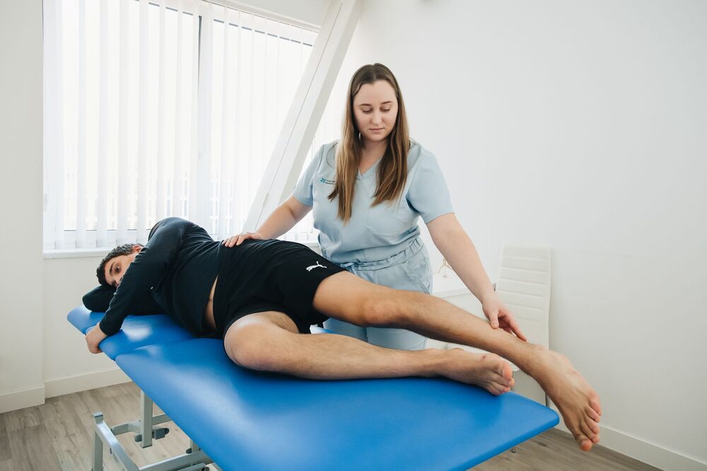 Patient completing an online physiotherapy booking on a mobile device