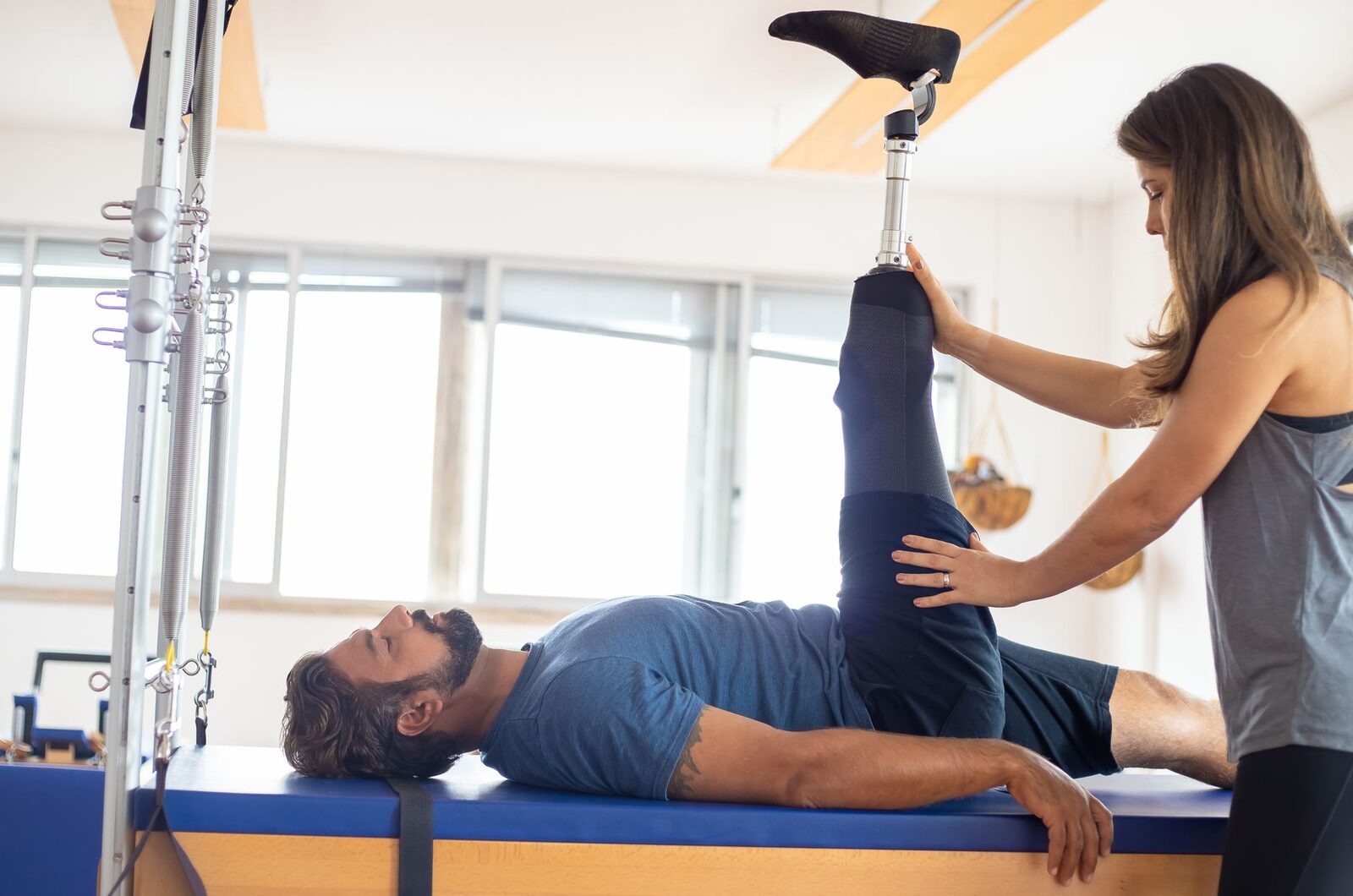 Physiotherapist guiding a patient through a rehabilitation exercise in an Edmonton clinic