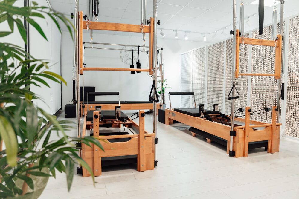 Bright, organised Pilates reformer studio ready for a class