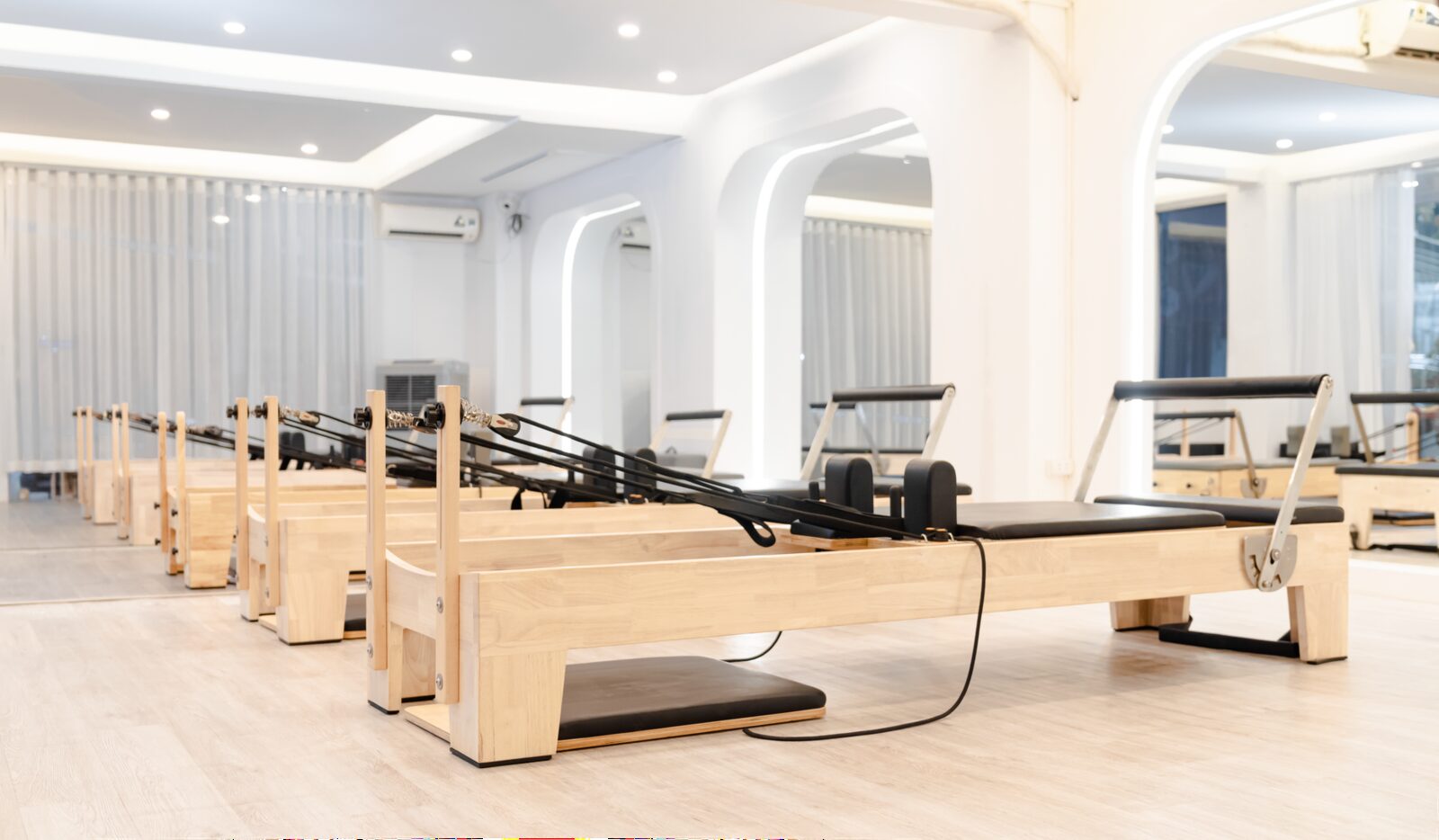 Reformer Pilates studio in Edmonton with neatly aligned equipment