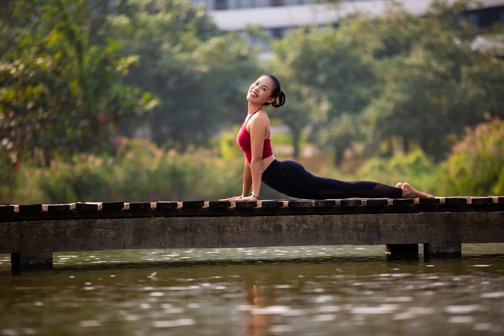 Students practising in a calm, light-filled Edmonton yoga studio